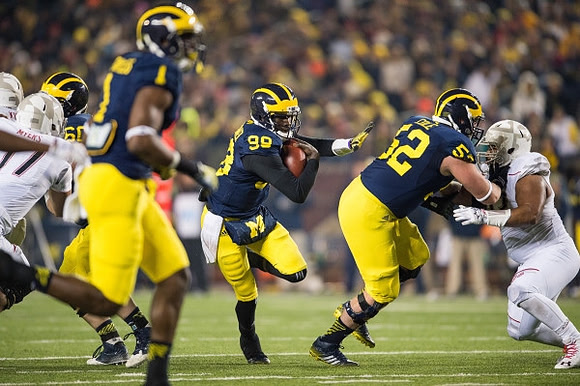 Devin Funchess (1), Devin Gardner (98), and Mason Cole (52)