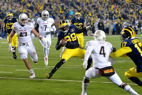 Kyle Kalis (67), Devin Gardner (98), Mason Cole (52), and Freddy Canteen (17)