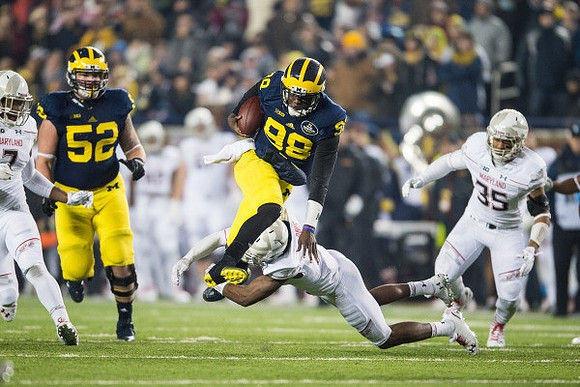 Mason Cole (52) and Devin Gardner (98)