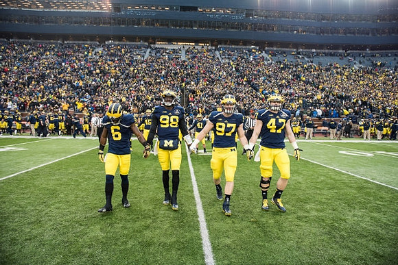 Raymon Taylor (6), Devin Gardner (98), Brennen Beyer (97), and Jake Ryan (47)