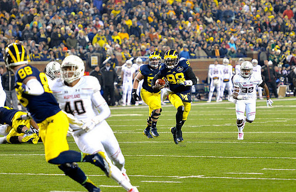 Jake Butt (88), Mason Cole (52), and Devin Gardner (98)