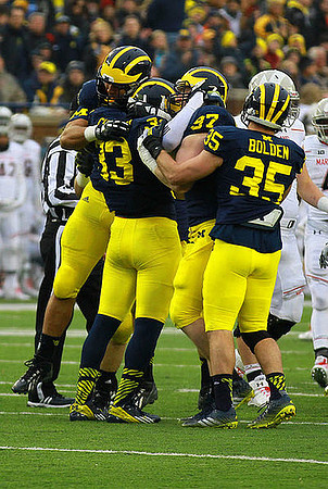 Taco Charlton (33), Brennen Beyer (97), and Joe Bolden (35)