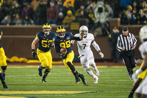 Mason Cole (52) and Devin Gardner (98)