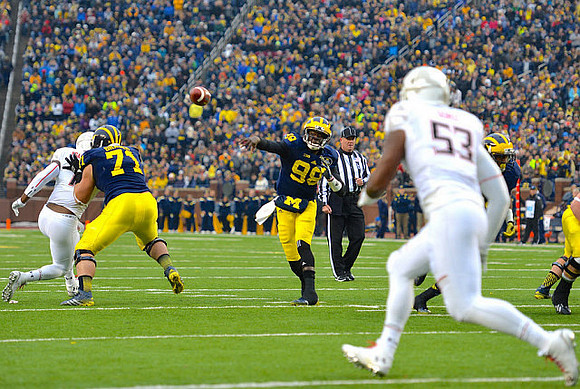 Ben Braden (71) and Devin Gardner (98)
