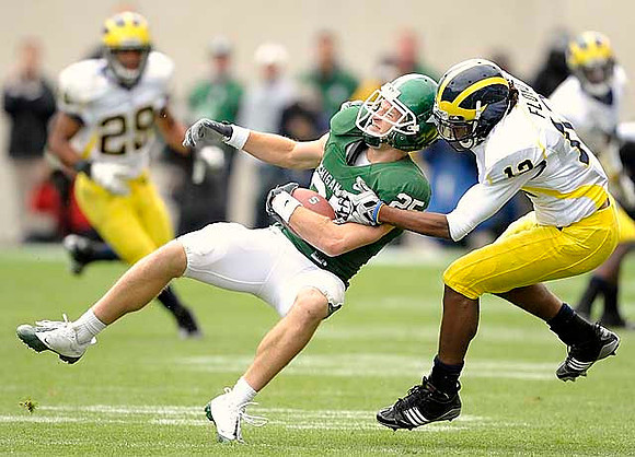 Troy Woolfolk (29) and J.T. Floyd (12)