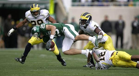 Troy Woolfolk (29), Stevie Brown (3), and J.T. Floyd (12)