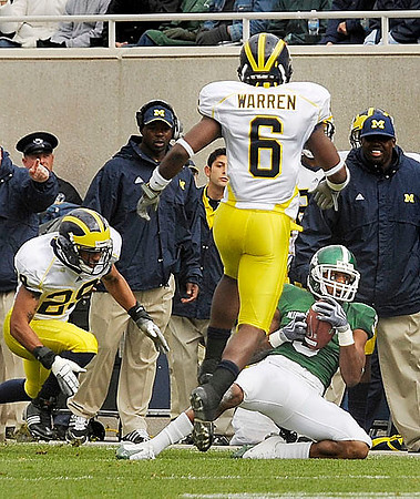 Troy Woolfolk (29) and Donovan Warren (6)