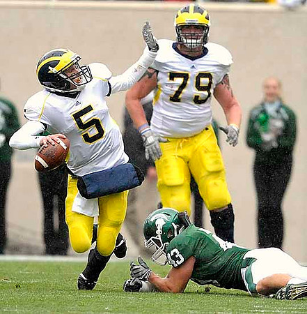 Tate Forcier (5) and Perry Dorrestein (79)