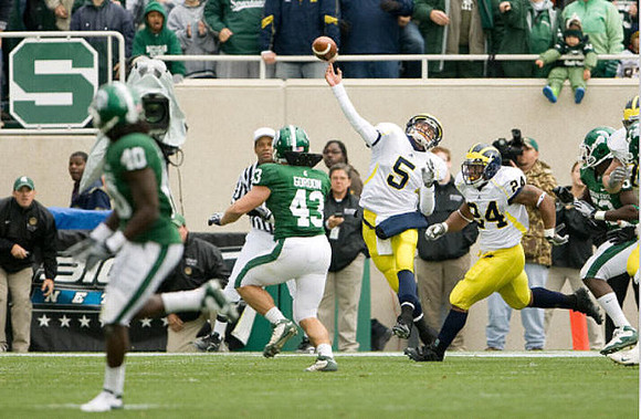 Tate Forcier (5) and Kevin Grady (24)