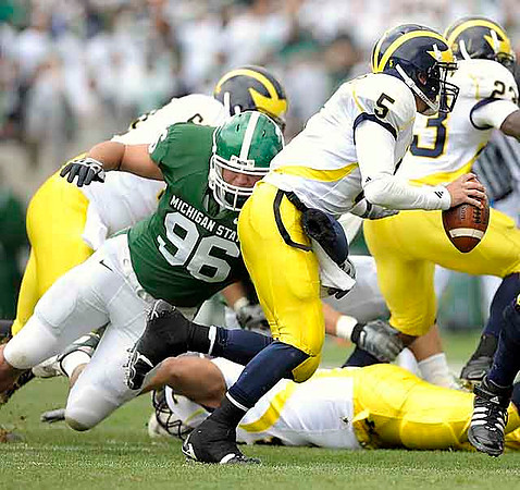 David Moosman (60), Tate Forcier (5), and Carlos Brown (23)