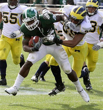 Brandon Graham (55), Jordan Kovacs (32), Troy Woolfolk (29), and Ryan Van Bergen (53)