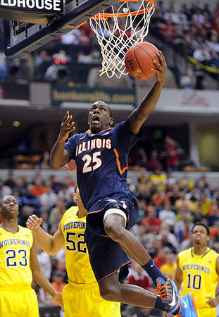 Caris LeVert (23), Jordan Morgan (52), and Derrick Walton Jr. (10)