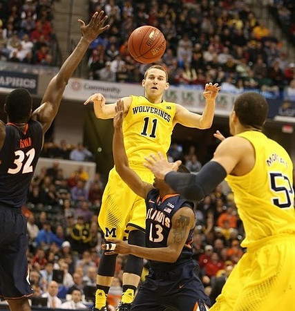 Derrick Walton Jr. (10), Caris LeVert (23), Jon Horford (15), Glenn Robinson III (1), and John Beilein