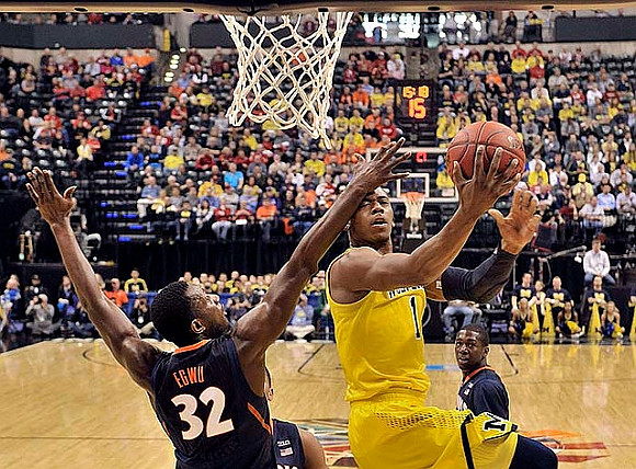Glenn Robinson III (1), Caris LeVert (23), and Nik Stauskas (11)
