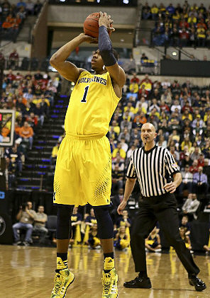 Caris LeVert (23), Jordan Morgan (52), and Glenn Robinson III (1)