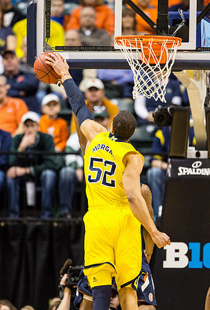 Jon Horford (15) and Caris LeVert (23)