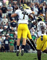 Chad Henne, Mario Manningham, and Obi Oluigbo