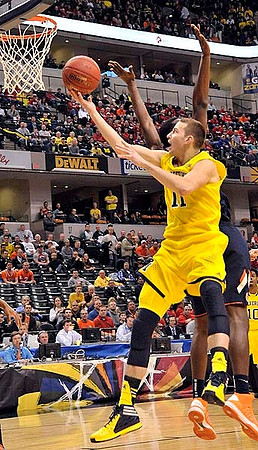Spike Albrecht (2), Glenn Robinson III (1), and Jon Horford (15)
