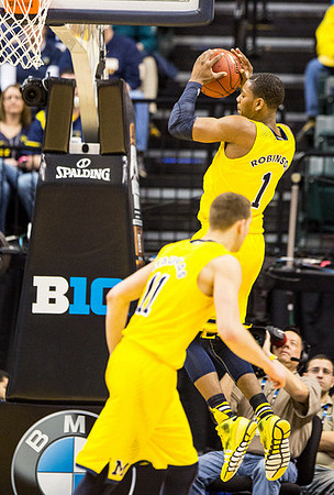 Caris LeVert (23) and Mitch McGary (4)