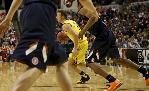 Glenn Robinson III (1) and Jordan Morgan (52)