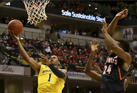 Andrew Dakich (5), Mitch McGary (4), and Zak Irvin (21)
