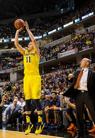 Jordan Morgan (52), Glenn Robinson III (1), and Caris LeVert (23)