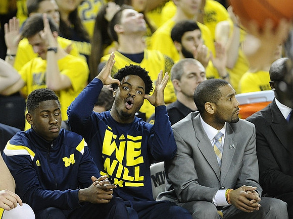 Caris LeVert (23), Derrick Walton Jr. (10), and LaVall Jordan