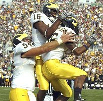 Mark Bihl, Adrian Arrington, and Mario Manningham