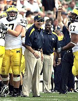 Lloyd Carr, Adam Kraus, and Brandon Harrison