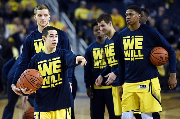 Jon Rubenstein, Max Bielfeldt (44), Derrick Walton Jr. (10), Austin Hatch (30), and Kameron Chatman (3)