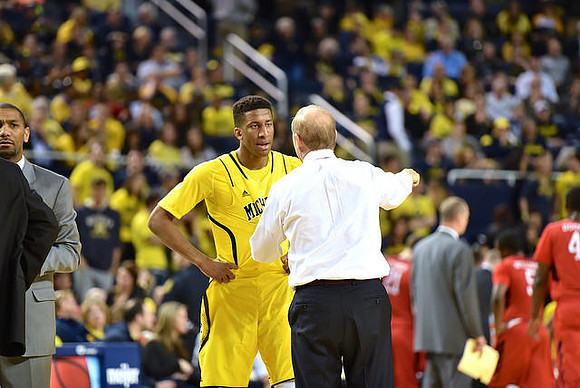 LaVall Jordan, Aubrey Dawkins (24), and John Beilein