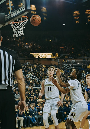 Colin Castleton (11) and Zavier Simpson (3)