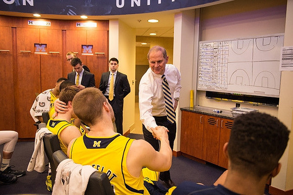 Max Bielfeldt (44), John Beilein, and Michigan Team