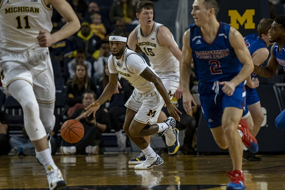 Colin Castleton (11), Zavier Simpson (3), and Jon Teske (15)