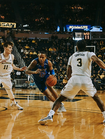 Colin Castleton (11) and Zavier Simpson (3)