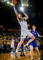 Jon Teske (15), Eli Brooks (55), and Juwan Howard
