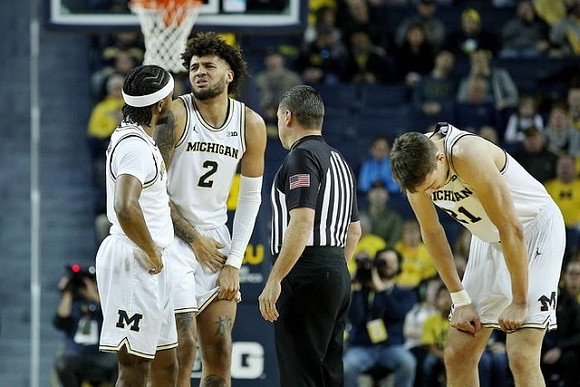 Zavier Simpson (3), Isaiah Livers (2), and Franz Wagner (21)