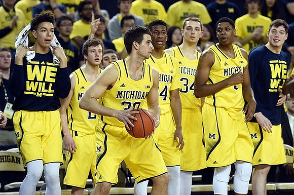 Austin Hatch (30) and Michigan Team