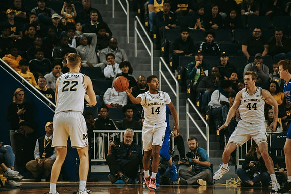 Cole Bajema (22), Rico Ozuna-Harrison (14), and Jaron Faulds (44)