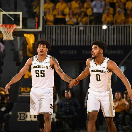 Eli Brooks (55) and David DeJulius (0)