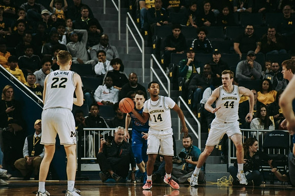 Cole Bajema (22), Rico Ozuna-Harrison (14), and Jaron Faulds (44)