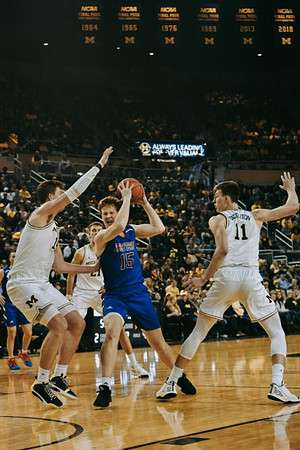 Jon Teske (15), Franz Wagner (21), and Colin Castleton (11)