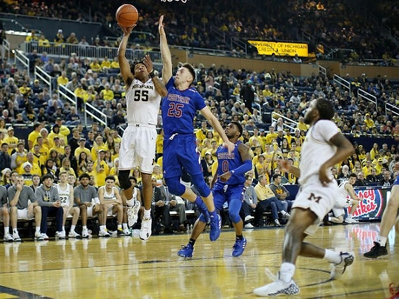 Eli Brooks (55) and Zavier Simpson (3)