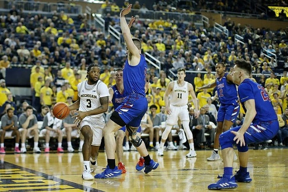 Zavier Simpson (3) and Colin Castleton (11)