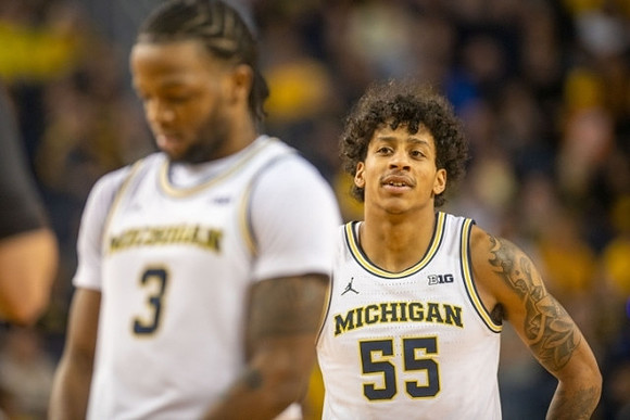 Zavier Simpson (3) and Eli Brooks (55)