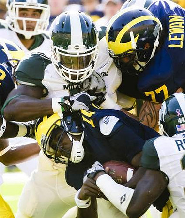 Denard Robinson (16) and Taylor Lewan (77)
