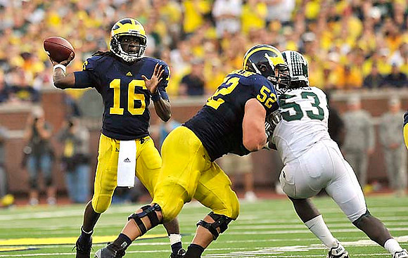Denard Robinson (16) and Stephen Schilling (52)