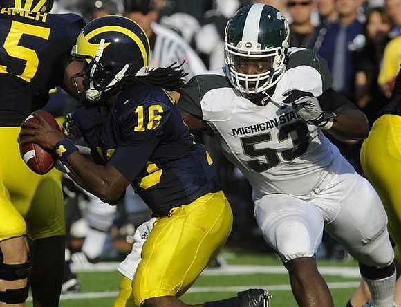 Patrick Omameh (65) and Denard Robinson (16)