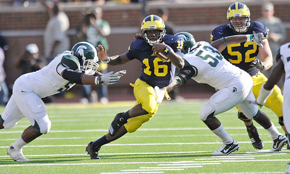 Denard Robinson (16) and Stephen Schilling (52)