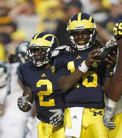 Vincent Smith (2), Denard Robinson (16), and Patrick Omameh (65)